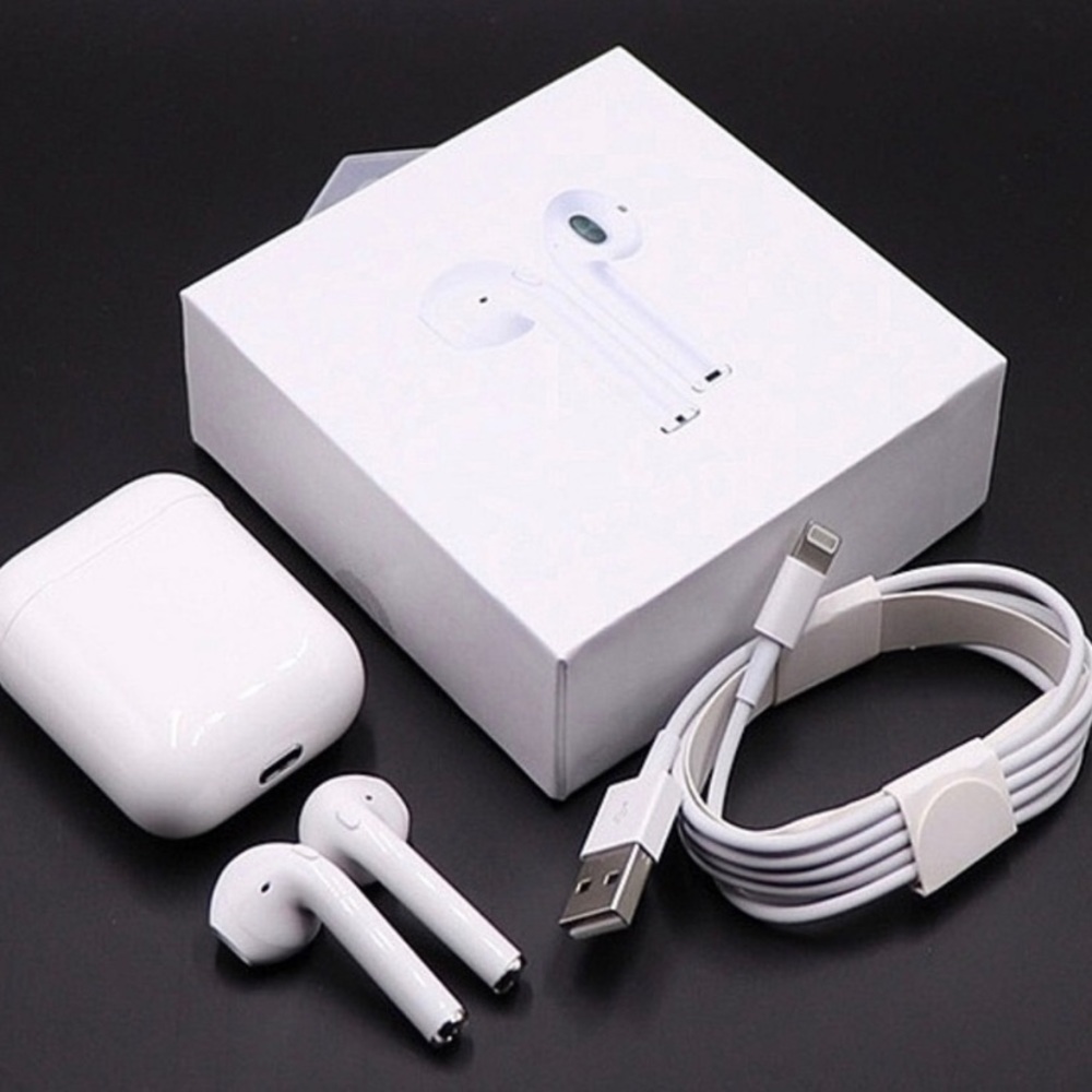 White wireless earbuds with charger box